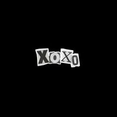 the word xoxo spelled in cut out letters on a black background with space for text