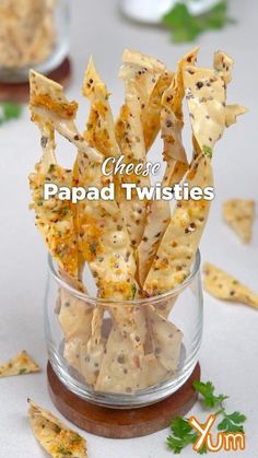 some crackers are in a glass bowl on a table