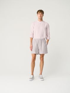 "Easily the comfiest linen shorts out there. Offered in medium-weight linen. If you're interested in a longer & bit more chic shorts option, check our men's shorts LIMA.  STYLE DETAILS * Regular fit * Elasticated waist * No closure * 2 side pockets * Mini length * Made from medium-weight linen SIZES & COLORS IN PICTURES * Model wears size M in color Pearl Grey. He is 188 cm (6'2\"). Chest - 97 cm (38\"), waist - 83 cm (33\"), hips - 97 cm (38\"). NOTES ON SIZING & COLORS * Please note that linen shrinkage during the softening process cannot be predicted precisely. Therefore, each piece in the same size can vary 1-2 cm. * The actual color may be slightly different due to screen settings. If the exact color is important to you, we advise ordering the Color Guide. MAKE-TO-ORDER / CUSTOMIZATIO Linen Bermuda Shorts With Built-in Shorts And Relaxed Fit, Beach Linen Shorts With Relaxed Fit, Relaxed Fit Linen Shorts For Vacation, Relaxed Fit Flax Bottoms For Summer, Summer Relaxed Fit Flax Bottoms, Summer Linen Bermuda Shorts With Elastic Waistband, Flax Colored Bottoms For Beach In Summer, Linen Bermuda Shorts For Loungewear, Bermuda Linen Shorts For Loungewear