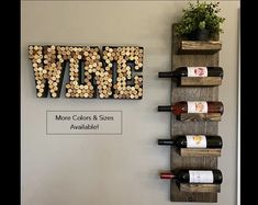 the wine rack is made out of wood and has several bottles on it, as well as a sign that says vine