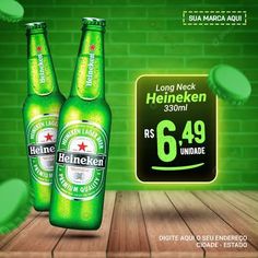 two bottles of heineken beer sitting on top of a wooden floor next to a green brick wall