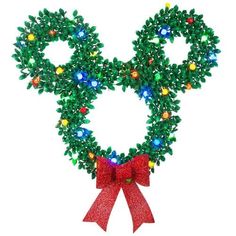 a christmas wreath shaped like mickey mouse's head with lights on it and a red bow