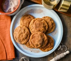 some cookies are sitting on a plate next to other items