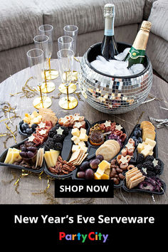 new year's eve party platter with champagne, crackers and cheeses