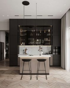 two bar stools sit in front of the kitchen counter