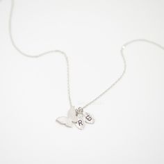 "These personalized butterfly necklaces will be perfect thank you gifts for your wedding, anniversaries, Mother's day and birthdays. You can also gift these to yourself with your kids/babies initials to keep your loved ones close to your heart at all times. Great minimal necklaces for layering or for easy, everyday wear. D E T A I L S - Dainty Butterfly + Initial Leaf charm of your choice - Butterfly size: 14mm x 9mm/ - Leaf size: 9mm x 6mm - Hand-Stamped Initial of your choice (we can stamp a c Dainty Butterfly Necklace, Necklace For Kids, Butterfly Necklaces, Gold Butterfly Necklace, Dainty Butterfly, Butterfly Necklace Gold, Lovers Necklace, Minimal Necklace, Heart Symbol