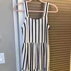 Soft Material, Loose Fit Black And White Sleeveless Midi Dress For Summer, Casual Black And White Midi Dress, White Lined Casual Midi Dress, Casual White Lined Midi Dress, Casual Black And White Sleeveless Mini Dress, Casual Sleeveless Black And White Mini Dress, Casual Black And White Mini Dress For Spring, Casual Black And White Mini Dress For Summer, Casual Black And White Midi Dress For Summer