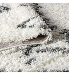 a white and black rug with a zipper on it