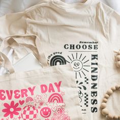 Spread some good vibes with this Choose Kindness T-shirt! Made of 100% cotton, it's super-comfy, with an over-sized, relaxed fit so you can show your laid-back style while spreading a positive message. Be kind to yourself and others - you can't go wrong! Trendy Cotton T-shirt With Graphic Design, Casual Organic Cotton Tops With Graphic Design, Fun Slogan T-shirt For Everyday, Trendy Graphic Design Tops For Everyday, Comfortable Graphic Print T-shirt For Streetwear, Comfortable Cotton T-shirt With Screen Print, Trendy Cotton T-shirt With Screen Print, Summer Graphic Design Organic Cotton T-shirt, Conscious Style Cotton T-shirt For Everyday