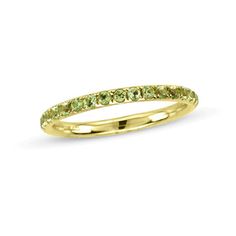 On your wedding day, seal your vows with this distinctive gemstone band. Created in warm 14K gold, this slender band is lined with glistening spring-green peridot in durable prong settings. Lovely alone, stacked with others or paired with her diamond engagement ring, this non-traditional design is an elegant choice. A look she'll love, this ring is finished with a bright polished shine. Peridot Wedding Band, Peridot Ring Gold, Eternity Band Stack, Peridot Stone, Local Jewelry, Eternity Wedding Band, Ring Minimalist, Minimalist Ring, Minimalist Rings