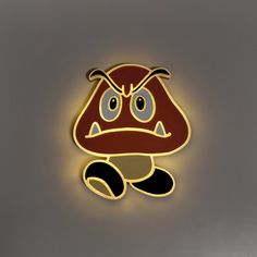 a close up of a light on a wall with a cartoon character in the middle