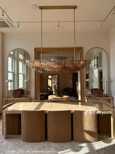 an elegant dining room with round tables and stools in front of large mirrors on the wall