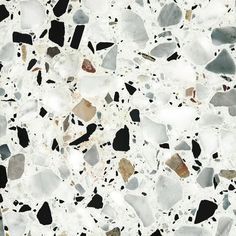 an image of a white and black counter top with pebbles on the bottom, in different colors