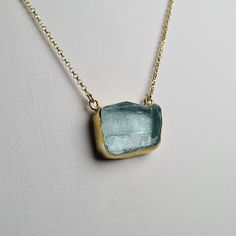 "👌 An exclusive  collection with Aquamarine natural gemstones. ✔️ Pendant Necklaces handcrafted all in Sterling Silver 925, with Gold filling 18K and an impressive raw and unpolished light blue Aquamarine gemstone. ✔️ Aquamarine light blue color shows stunning and how the stone really looks like in it's natural state. You can choose between these 3 different shape pendants. Every pendant is unique and one time made to match each stone. 📏 1. first in photos  triangle shape pendant necklace: 2.6cm (1\") X  1.5cm (0.6\"). Necklace's length is  min. 48.5- max.51.5cm (19.1\"-20.3\"). Extra links are attached for you to adjust it's length.       2. second in photos square shape pendant: 2.5cm (1\") X  1.9cm (0.75\"). Necklace's length is min. 44- max. 49cm (17.3\"-19.3\"). Extra links are atta Aquamarine Gemstone Pendant Jewelry, Aquamarine Gemstone Jewelry For Jewelry Making, Aquamarine Pendant Jewelry With Natural Stones, Handmade Blue Topaz Jewelry, Aquamarine Pendant With Natural Stones, Handmade Blue Topaz Blue Jewelry, Elegant Apatite Necklace As Gift, Gold Aquamarine Jewelry With Natural Stones, Elegant Apatite Necklace For Gifts