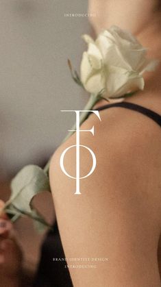 the back of a woman's body with a flower on it