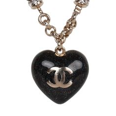 This Chanel necklace features a reversible Black glitter enamel heart charm with the classic CC motif on the front and a crystal embellished CC heart charm design on the reverse side. The chain is silver tone in a Rolo design with 6 black beads and faux crystals near the heart charm. The necklace features a lobster claw closure. Origin: France Condition: New and never worn Accompanied by: Chanel box and pouch, retail UPC Measurements: Chain 9" Pendant .75" x .75" Chanel Box, Chanel Necklace, Crystal Heart Pendant, Quality Handbags, Best Bags, Chanel Black, Black Glitter, Crystal Heart, Black And Silver