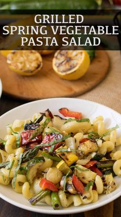 grilled spring vegetable pasta salad in a white bowl