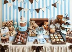 a table filled with teddy bears and cakes