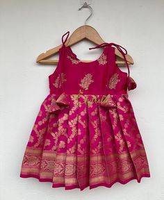 "BUYER'S PLEASE LEAVE YOUR CONTACT NUMBER. It's necessary for shipping. READY TO DISPATCH Age: 0-2 Years. Baby girls dark pink Banarasi chanderi brocade knot frock. The Yoke portion of frock made with soft silk with floral butte design and the skirt portion is made on Banarasi chanderi brocade- chanderi silk fabric. The dress is fully lined with soft cotton and the stitches are concealed. So your little princess feels comfortable in this frock. A man's daughter is his heart💓. Just with little f Mommy Daughter Dresses, Kuchu Designs, Frock Designs, Saree Kuchu Designs, Kids Blouse