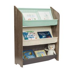 a wooden book shelf with books on it and a stuffed animal next to the shelves