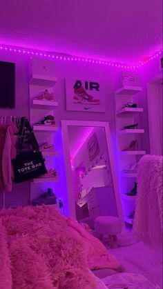 a bedroom with purple lights and pink fur on the bed, in front of a book shelf