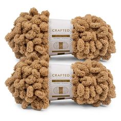 two balls of crafted yarn are shown in front of each other on a white background