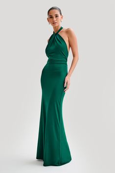 For the perfect guestThe ELYNA Slinky Halter Maxi Dress is the epitome of elegance and allure. Its halter neckline and ruched centre front exude sophistication, while the low back adds a touch of sultry charm. With ruched centre back detail, this dress offers a flattering silhouette from every angle. Designed to hug your curves, its bodycon fit accentuates your figure effortlessly. Perfect for any special occasion, the maxi length adds drama and elegance to your ensemble. Embrace timeless style Elegant Green Halter Backless Dress, Formal Halter Dress With Ruched Bodice, Formal Halter Neck Maxi Dress With Ruched Back, Green Halter Neck Dress For Formal Occasions, Formal Halter Neck Evening Dress With Ruched Bodice, Elegant Backless Halter Dress With Ruched Bodice, Elegant Green Halter Neck Dress, Formal Halter Neck Backless Dress With Ruched Back, Formal Stretch Maxi Dress With Ruched Back