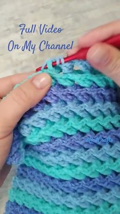 someone is crocheting the stitchs together to make a small bag with yarn