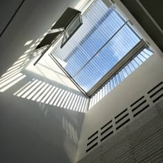 the skylight is shining brightly into the room