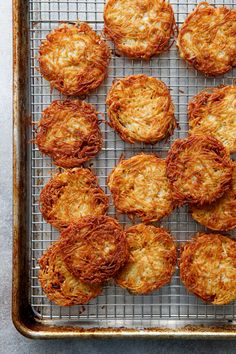 some food is sitting on a wire rack and ready to be cooked in the oven