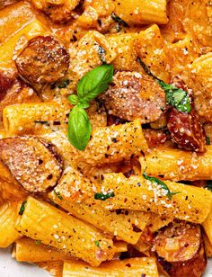 pasta with sausage, tomato sauce and parmesan cheese