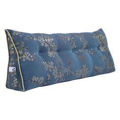 a blue pillow with flowers on it