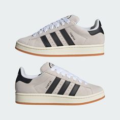 CAMPUS 00S SHOES CLASSIC SHOES WITH AUTHENTIC 2000S SKATE VIBES. Proportions are changing, and personal style reigns supreme. With a new perspective on our Campus 80s, these adidas trainers show bold simplicity at their best with a clean suede upper and classic contrasting 3-Stripes. Updated proportions inspired by the 2000s skate era bring an authentic, self-defined vibe to your everyday style. More Details Regular fit Lace closure Suede upper Textile lining Gum rubber outsole Color: Crystal White Black Style: GY0042 Adidas Campus 00s Beige, Campus 00s Shoes, 00s Shoes, Clean Suede, Adidas Campus 00s, How To Clean Suede, Shoe Wishlist, Adidas Trainers, Crystal Shoes