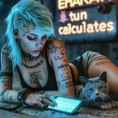 a woman with tattoos is looking at her cell phone while holding a cat in front of her