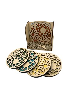 four wooden coasters with laser cut designs on the front and back, in an open box