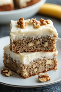 two pieces of cake sitting on top of a white plate