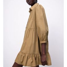 Mini Dress With Lapel Collar And Long Sleeves. Flounced Hem. Front Button Closure With Top Jewel Button. 100% Cotton Color Light Camel Xl: Armpit To Armpit 21”, Length 34” L: Armpit To Armpit 20”, Length 34” Casual Collared Mini Dress With Button Cuffs, Casual Shirt Dress With Ruffles For Dress Down, Casual Ruffled Shirt Dress For Fall, Casual Shirt Dress With Ruffles For Dress Down Occasions, Collared Beige Mini Dress With Button Closure, Beige Collared Mini Dress With Button Closure, Cotton Ruffled Button-up Shirt Dress, Cotton Button-up Shirt Dress With Ruffles, Beige Collared Dress With Button Cuffs