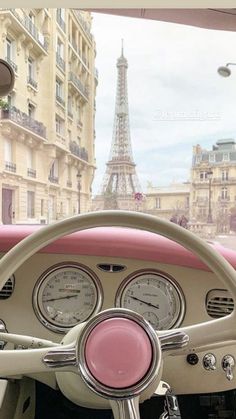 the interior of an old car in front of the eiffel tower, paris