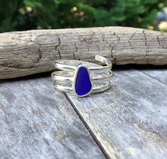 a blue ring sitting on top of a wooden table