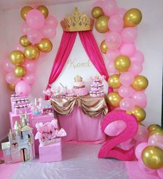 a pink and gold princess birthday party with balloons, streamers, tablecloths and decorations