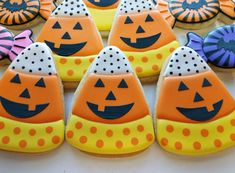 decorated cookies are arranged in rows on a table