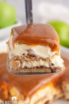 a piece of cake on a fork with caramel and ice cream in the middle