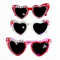 Show your little some love with these custom valentines sunnies! Choose your color and your style! All styles come with a beaded name. Please choose your style from the examples pictured. Beads Only: white glasses Bling: pink glasses Extra Bling: red glasses Beaded Heart Sunglasses, Pink Heart-shaped Sunglasses As Gift, White Heart-shaped Sunglasses For Valentine's Day, Red Heart-shaped Sunglasses For Valentine's Day, Sunglasses For Girls, Playful Heart-shaped Sunglasses For Valentine's Day, Valentine Name, White Glasses, Pink Glasses