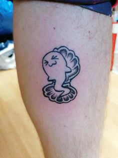 a person with a small tattoo on their leg