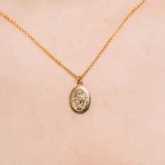 This gold-filled double-clad pendant necklace features a Miraculous Medal—also known as the Medal of the Immaculate Conception—design with fine details. When the medal first came into being, it was called the Medal of the Immaculate Conception. In less than ten years it became known at the Miraculous Medal because of the many graces and wonders that quickly became associated with wearing it. Having this medal around our necks at all times is a constant reminder to pray. And as Mary promised, tho Dainty Oval Pendant Charm Necklace, Gold Pendant Charm Necklace With Miraculous Medal, Dainty Charm Necklaces With Miraculous Medal As Gift, Dainty Charm Necklaces With Miraculous Medal For Gifts, Dainty Miraculous Medal Charm Necklaces As Gifts, Dainty Miraculous Medal Charm Necklace As Gift, Gold Miraculous Medal Pendant Necklace, Dainty Gold Medallion Necklace, Virgin Mary Necklace Gold