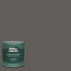 a can of behrut ultra stain - blocking paint on a gray background,