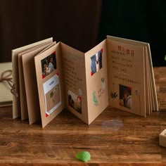 an open book sitting on top of a wooden table