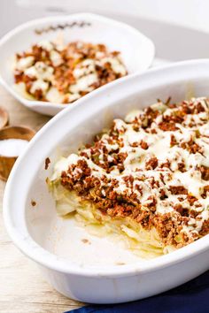 a casserole dish filled with meat and cheese