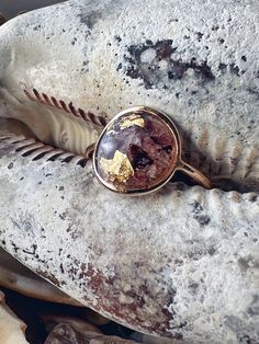 a ring sitting on top of a rock