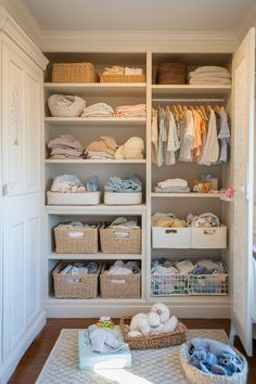 Organized nursery closet with woven baskets and neutral-toned baby items. Perfect for cozy nursery ideas and luxury baby nursery inspiration. Narrow Nursery, Functional Nursery, Multifunctional Furniture